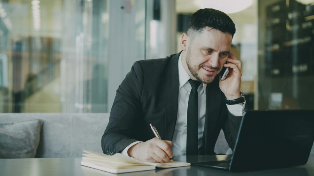 Smiling consultant on phone with client