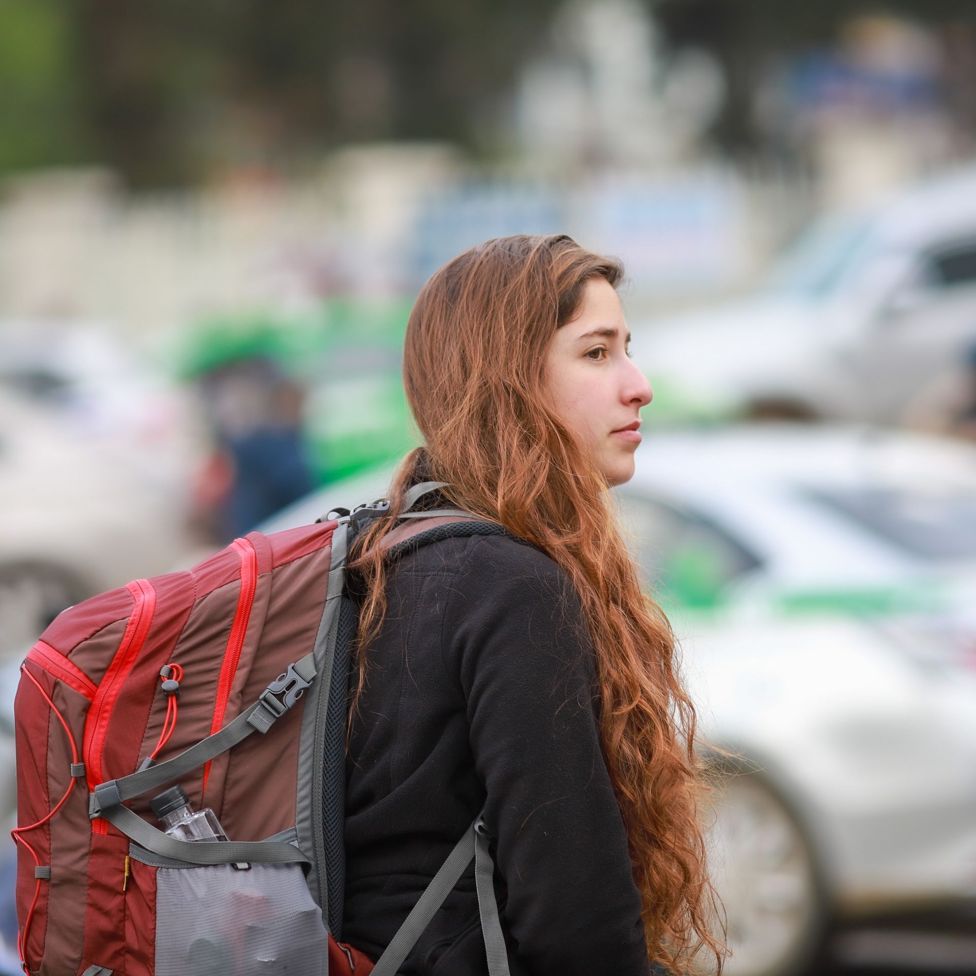 Student with backpack on campus